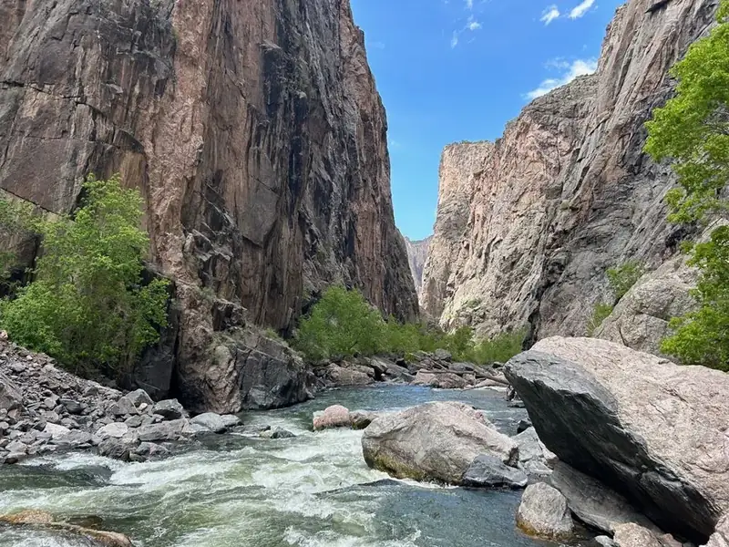A view of a river between two narrow steep canyons