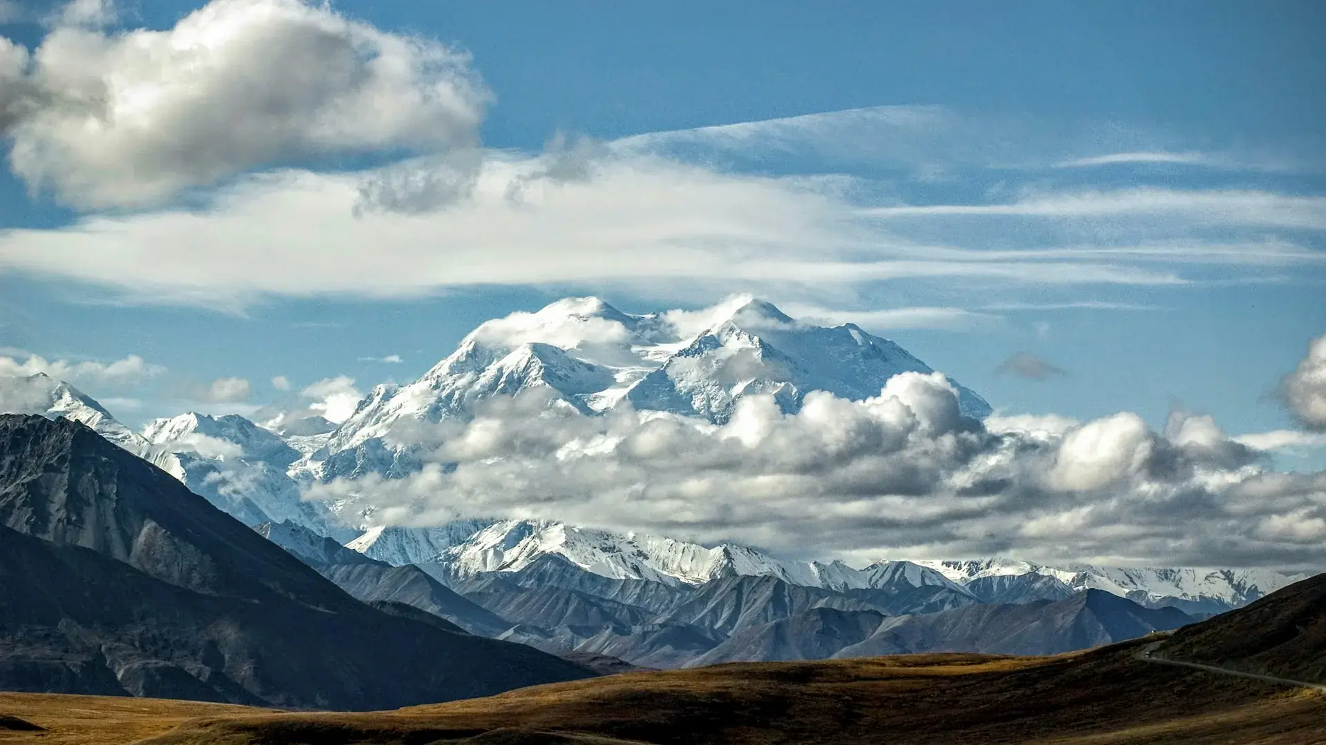 Snow covered mountain under blue sky during daytime