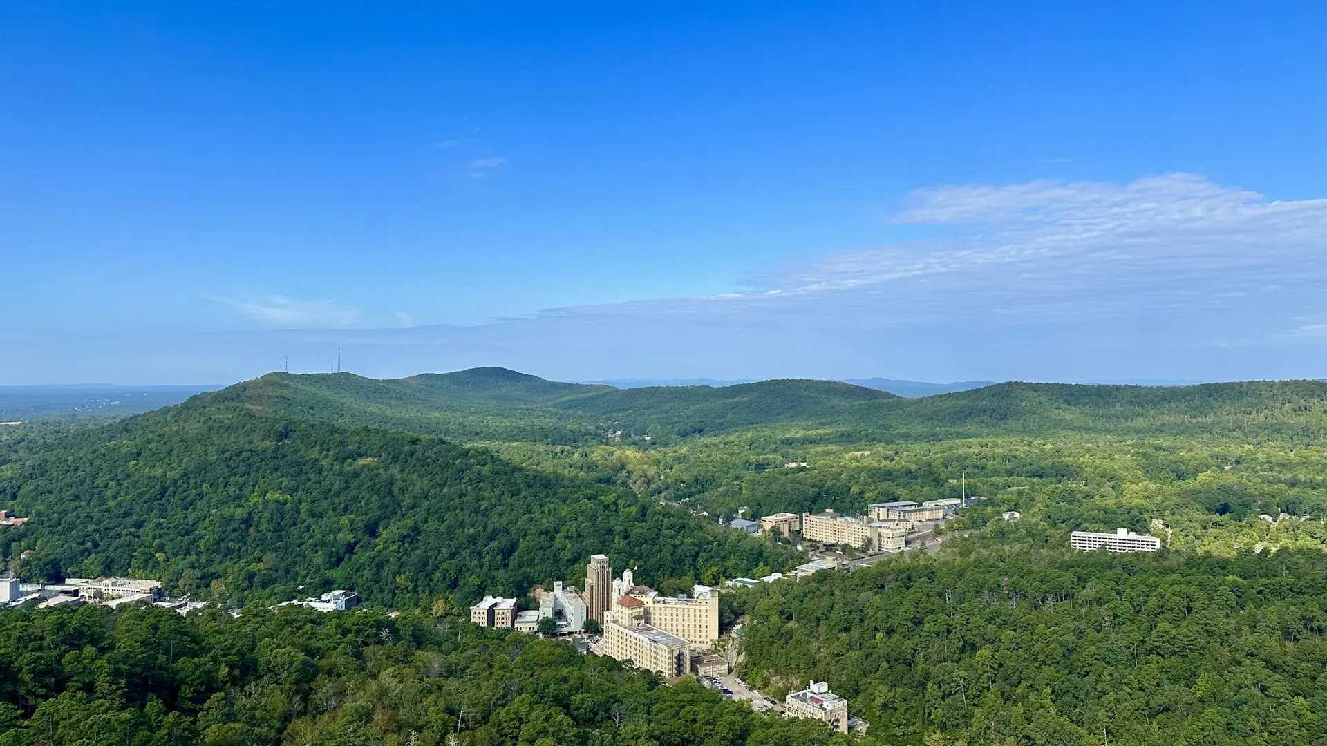 Forested hills surround historic downtown Hot Springs, seen from the park’s mountain tower.