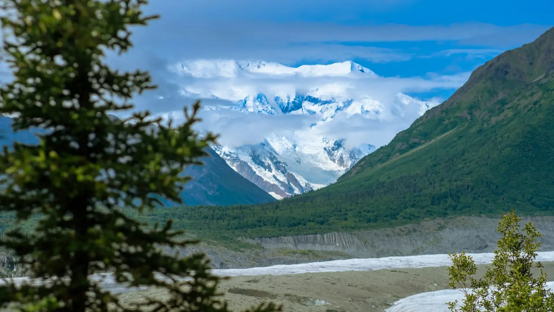 Snow-covered mountains and a glacial valley in Wrangell–St. Elias National Park.