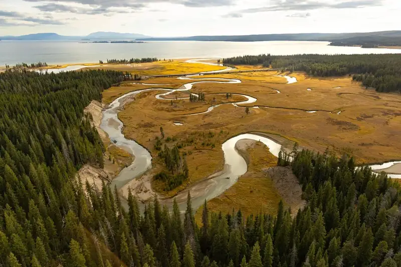 A creek winds towards a large lake